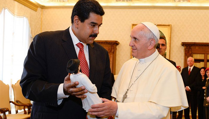 Venezuelan President Nicolas Maduro giving Pope Francis a gift in 2013 (AP)